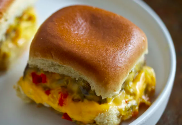 In times of war and times of peace the burger battles rage reliably on, true as the tide. The latest, greatest entrant into the discourse offers a hat tip to a lesser known style, the Connecticut steam burger, most commonly associated with White Castle sliders. 2007 F&W Best New Chef Gabriel Rucker has dreamt up a revision of the low brow icon for his PDX pub Canard : a griddled patty seasoned with French onion soup mix in an overcoat of American cheese, wedged between squishy halves of a sweet Hawaiian roll.