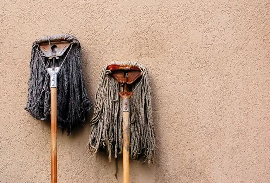 The horrible smell that an old mop has is the bacteria and germs it is growing.