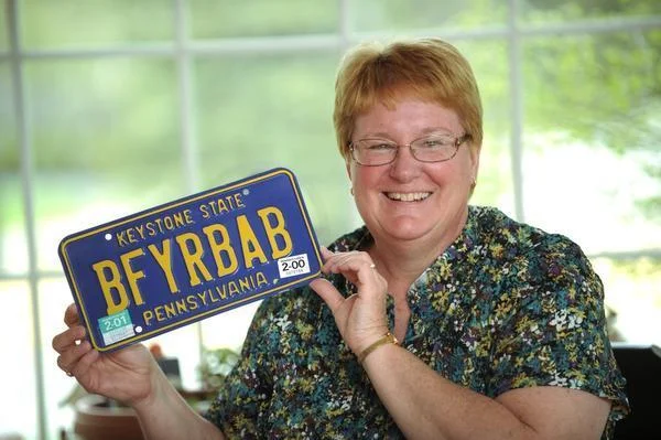 Karen Foard holds her license plate which in short says “breast feed your baby”. Karen Foard is a International Board Certified Lactation Consultant (IBCLC). Foard has been supporting, promoting, and educating people on breast feeding for the last 25 years. NABIL K. MARK — CDT photo