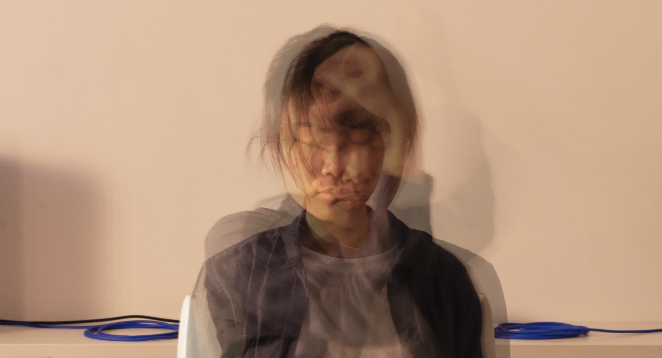 above: detail of a conversation with Ivy Tsui, March 2018 For a project that has been consciously approached as a rhizomatic process, it’s difficult to explain exactly what that process is without reducing it into too simple of a form. What takes place with each invited guest goes something along these lines: Each conversation begins nearly the same way. I ask the guest to take a seat in the white chair (the counterpart is black) as I open the door into a room, which has been carefully and minimally staged with lights and a small sound system. When they enter the room, an MPC (sampler/sequencer) is already playing a sound loop which I have selected somewhat randomly from an archive of unfinished material. Most of these loops are old sketches that I think I’m no longer interested in, though more often than not I surprise myself each time I pick a new one. I leave my guest alone in the room for a slightly longer period of time than I feel comfortable with before I enter and turn off the sound. I sit down and each time, share the same intimate anecdote; every guest is unique in their response. From this point, our conversation is improvised like any other, though with each repetition I’ve noticed that I slip more frequently back into the same questions and ways of responding, both intentionally and unintentionally. I hypothesize that my various partners also have several innate interjections and responses that come from a long life of practicing conversation—improvisation always drawing from our personal vocabularies and verbal safety nets. Similarly, when I started this process I always brought a journal that dates from the past 15 or so years, which is around the same amount of time that the MPC‘s memory card spans. The notebook initially served as a talking point in case the conversation needed some redirection but I’ve seldom (actually only once) relied on this prop and have stopped bringing them with me. Those books, which still remain important to part of my original intent of this project, all have a similar format: notes for unfulfilled projects alongside to-do lists, dream synopses, bits of lyrics, self-indulgent rants, scribbled ideas for projects or films or other never-realized ideas. Barely readable passages from books are interspersed with my own thoughts, often making reinterpretation necessary for any future use. A recent writing (which I highlighted in regards to this project), came from an unspecified podcast and is paraphrased: we live as materialists but we are constantly talking about the potential of things. So it is with each of these interactions; there’s been a contrasting expectation about each potential outcome. That expectation is something of a prelude or an echo that lies in direct contradiction with any intention of an immediate and spontaneous experience that one could reach out and touch. Contradiction would actually not be the right word, as that simplifies everything to a dichotomous view. As I said, I’m more interested in discovering the new layers that are created with each interaction, which is something I could (at least in a physical sense) for the time I’m with each of my guests, reach out and touch. So with contradiction aside, there are parts of the project which seem to be increasingly problematic, or have at least made me reconsider my original intent, but also seem compelling enough to develop (or at least not disregard) as a contrast to the temporal and intimate interaction that takes place. Here, I’m largely thinking of the sound collage which was developed early on in the process. My intent was to somehow “set free“ the sounds trapped on this machine, rather than letting them stay inside, where they were created, with only the slight potential of being used in their “looped” form one day. The idea was to give them a new life, turning them into transitory windows or putting them in some sort of liminal space that allows them to function as borders between fragments of the hours of conversations that have taken place. The theme of hoarding (digital, intellectual, physical...) has always been present and is referred to in my opening “lines“ of each conversation. In a sense, the collage illustrates perfectly this expectation to create more content out of the content that’s already there, accentuating the contrast of the actual experience vs. the selected/edited content chosen to present. To be fair, the collage becomes its own thing, standing apart from any single moment of each dialogue (or is it a performance?) that it’s partially made from. For me, the most intriguing part of what’s developed has come from the interactions with several dancers who have taken part. Each was asked to respond to certain aspects of the conversation, some themes that I specifically pushed (including the very theme of improvisation and our daily performance in each day of life.) These have now become conversations of their own, responding to each other in their artifact form. Some were dances on the mountain behind Chai Wan... some were improvisations in the same chair where I spoke with (and then photographed) each guest.