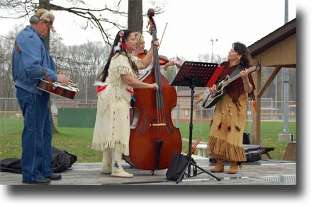 A Native American group sings for an audience at History Fest.