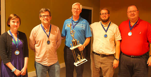  ​Bedford Laser Wash members, from left, Chelsea Jensen, Joe Voris, Dennis Whitaker, Terry Tlustek and Dennis Martin pose with the Brain Games XII trophy after winning the championship on Thursday, May 23. Photo by Marcey Burton, "Times Mail" 