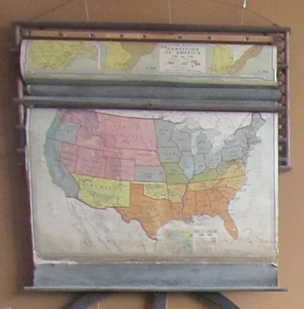  Sets of roll-down maps were hung on the wall in the front of the room. During geography class, the specific map would be rolled down so students could study them. This map set was used at the Springville School.&nbsp; 