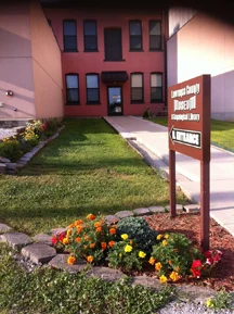 The north entrance is located near the large off-street parking lot.