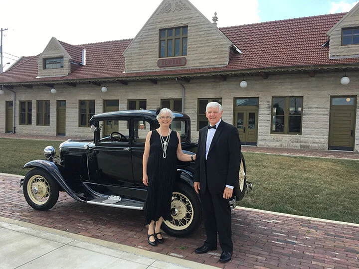 Bill Borden brought his Model A Ford, which had belonged to Leroy Morris, his grandfather. Guests enjoyed photo ops with this classy car.Here, Becky and Jim Buher enjoy the day.