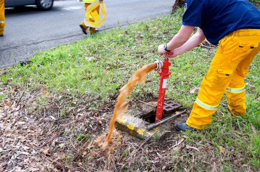 Testing water flow from hydrant