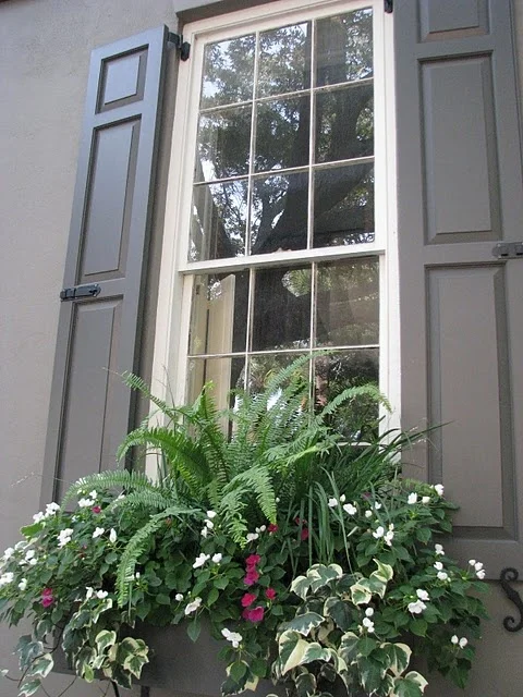 BUDGET ALTERNATIVE: ADD QUICK CURB APPEAL A new front door can make a home more eye-catching, but smaller projects can help, too. Painting an existing front door can cost as little as $50 in primer, paint, and supplies -- just be sure to pick the right color. While a bold, contrasting front door can make a house stand out, steer clear of gaudy hues that clash with the home's style or existing color scheme. (Still in doubt? White and red have perennial appeal, according to Angie's List .) Other cheap updates: Dress up plain windows with shutters for about $50 a pair, and consider adding flower-filled planters or window boxes for additional color.
