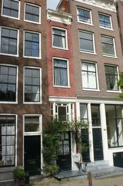 SINGEL 166 IN AMSTERDAM, HOLLAND This unassuming building is the narrowest house in Amsterdam at just under six feet wide. Like many narrow homes, however, the house gets more spacious as it extends back from the street.