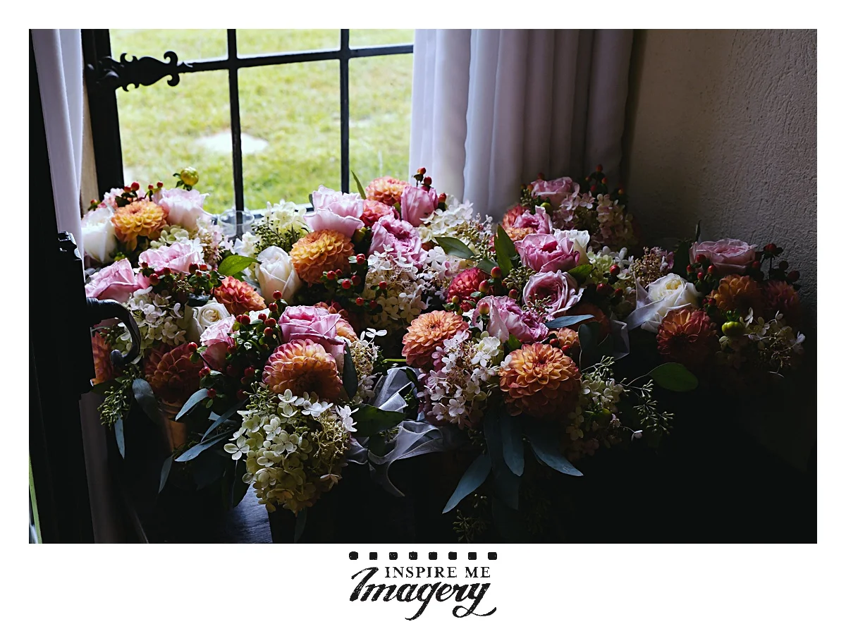 This was a September wedding, and the colors for the flowers were just stunning with the oranges, pinks, and purples.