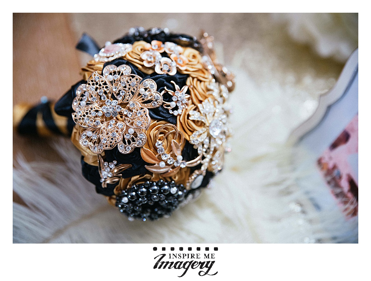 This brooch bouquet was stunning. The gold and blue in the pins came together so well.