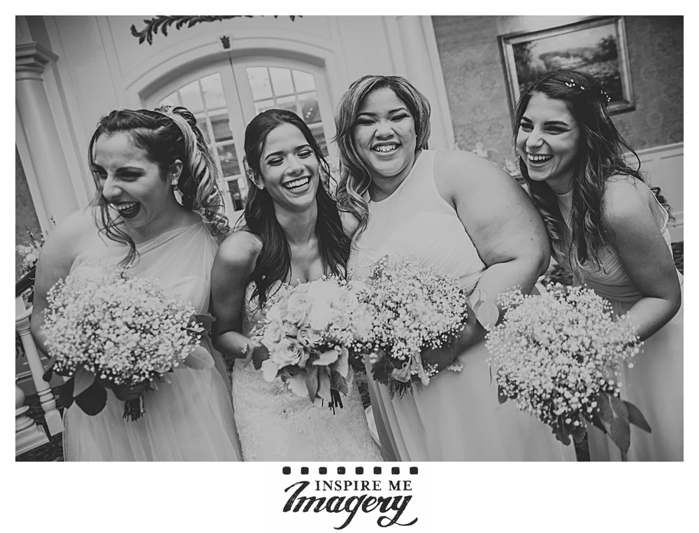The bride laughs with her girls before cocktail hour begins.
