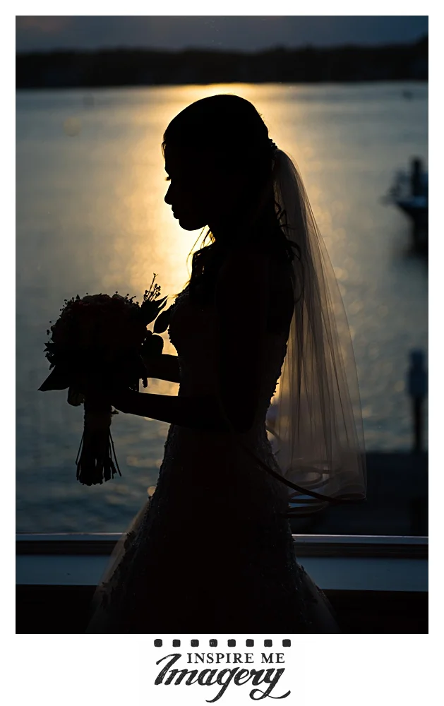 We took this portrait super quickly, right after the first dances ended. The bride stood next to the sweetheart table, followed our quick posing directions, and then was able to continue enjoying the evening. Like we said, the view from the reception room at Clarks Landing Yacht Club is killer.