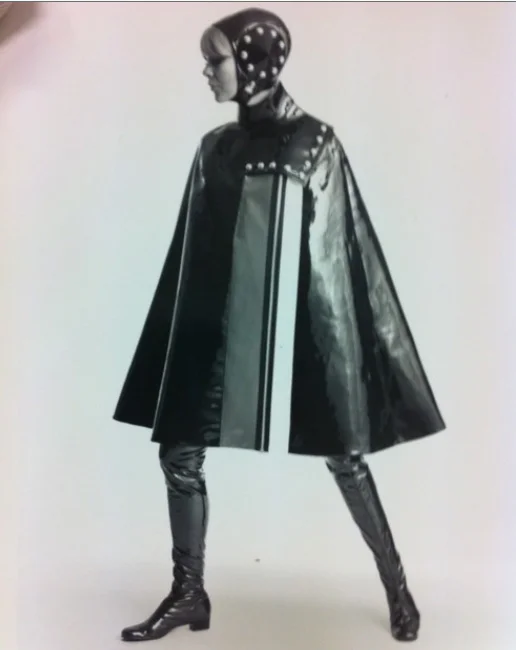 Photograph of young women in PVC cape and thigh-length boots, designer
unknown,1963-69, SA/AT/26/12/26