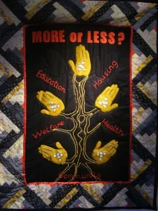 MORE or LESS? , quilted wall hanging created by older women from the Brixton community, 2011.