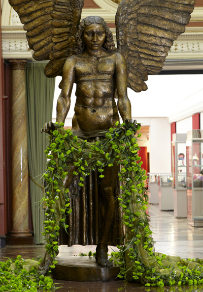 Jacob Epstein and Matt Smith, Lucifer holding a cape of green carnations , on display as part of Queering the Museum , Birmingham Museum and Art Gallery, 2010