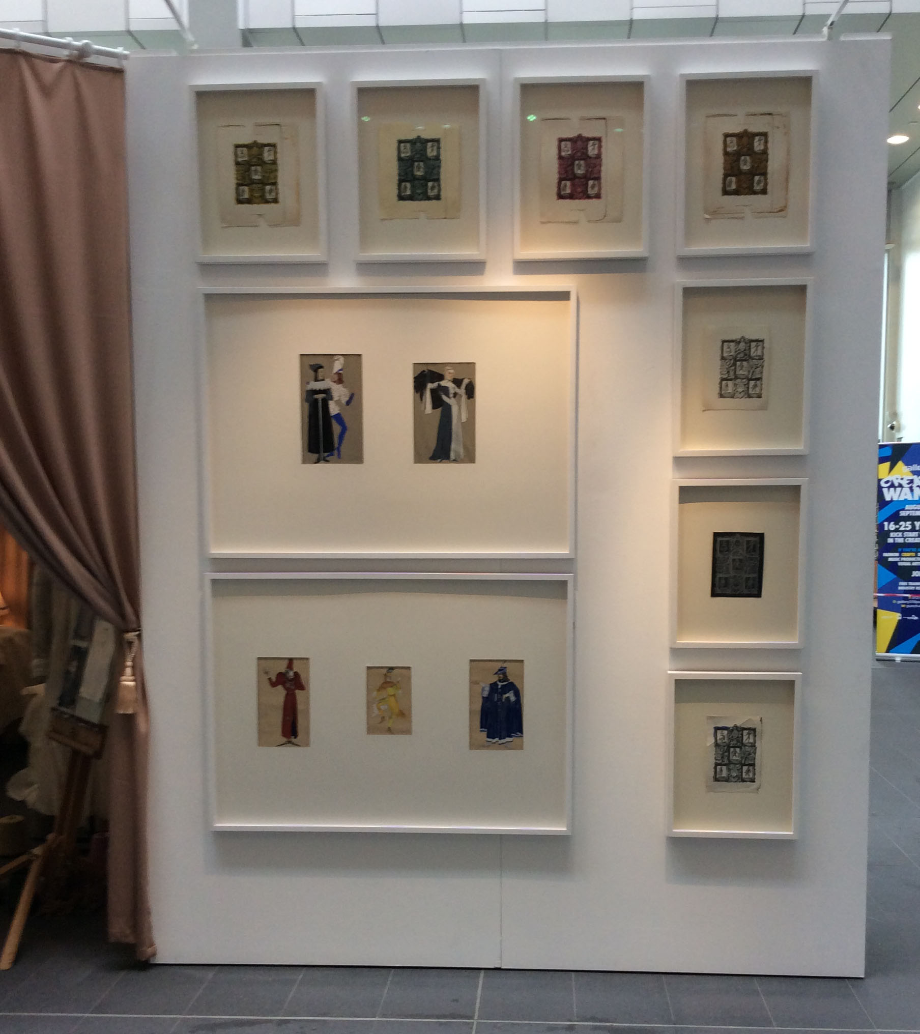 Installation shot of Cabinets of Costume exhibition showing designs for a book cover and theatrical costume designs by Meredith Hawes, 1930s, from BCU's Art & Design Archives, Parkside Gallery, May 2017.