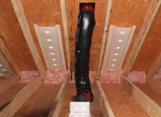 Example of air chutes installed at the soffits, where there is a soffit intake vent.