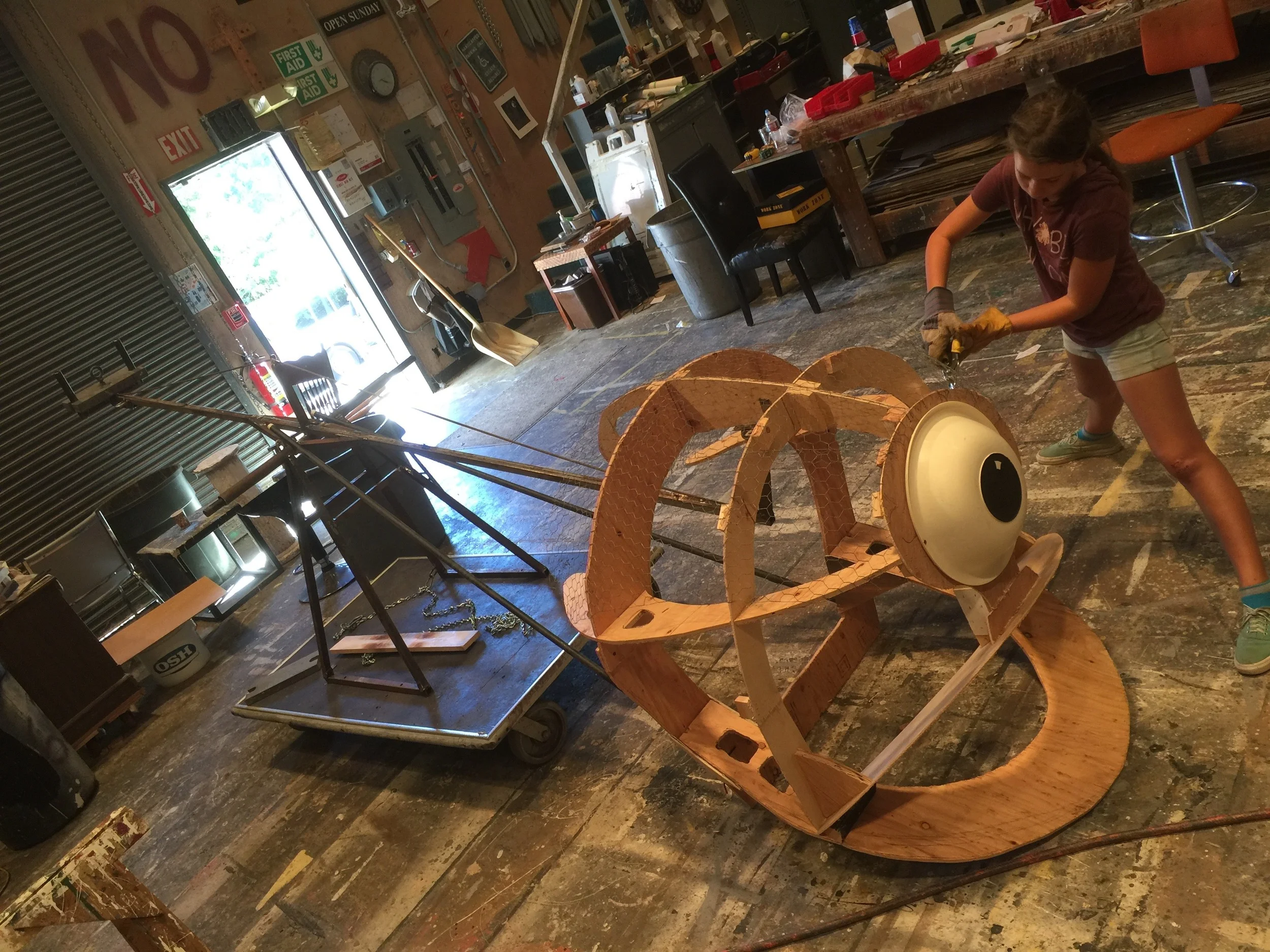 Beholder Monster head mounted on see-saw lift