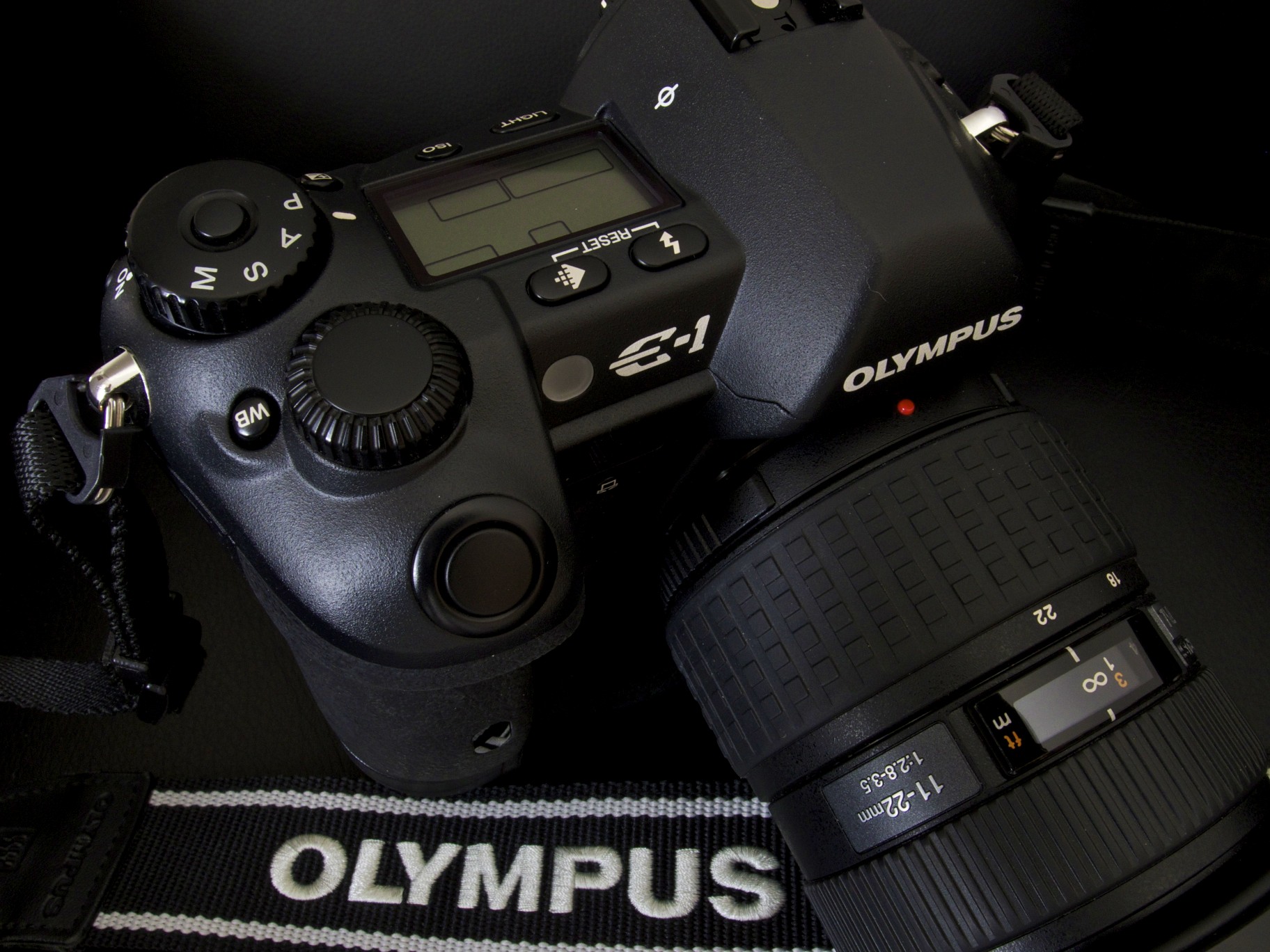 Available in 2003 as the first interchangeable-lens DSRL built 'from the ground up' as a Four Thirds System digital camera with a 5MP CCD sensor, the E-1 saw the re-introduction of the legendary Zuiko series of lenses in digital form and has to be one of the best-made cameras ever. I would never part with it. 749006150