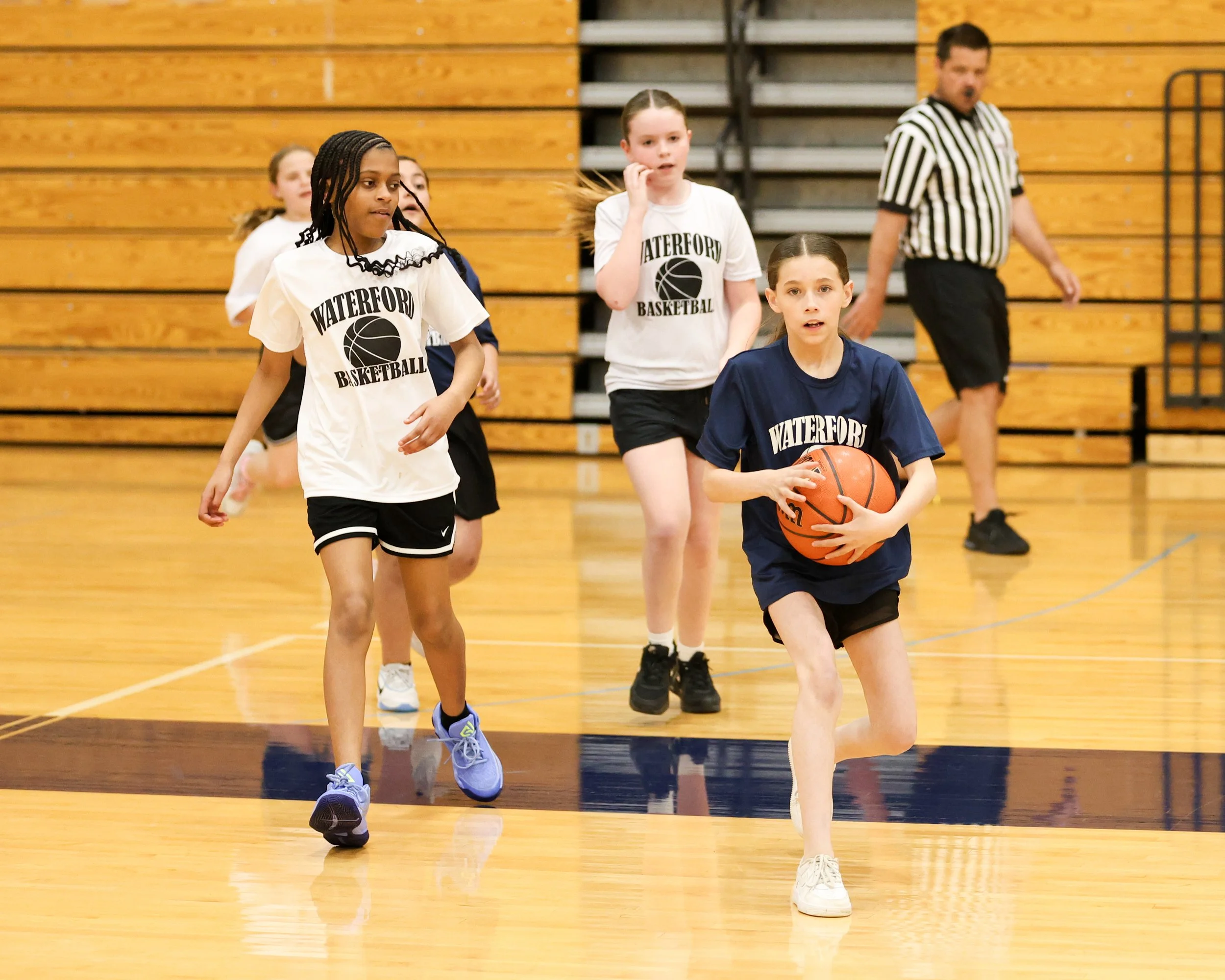 Donelson Hills girl holds the ball with Beaumont girl watching