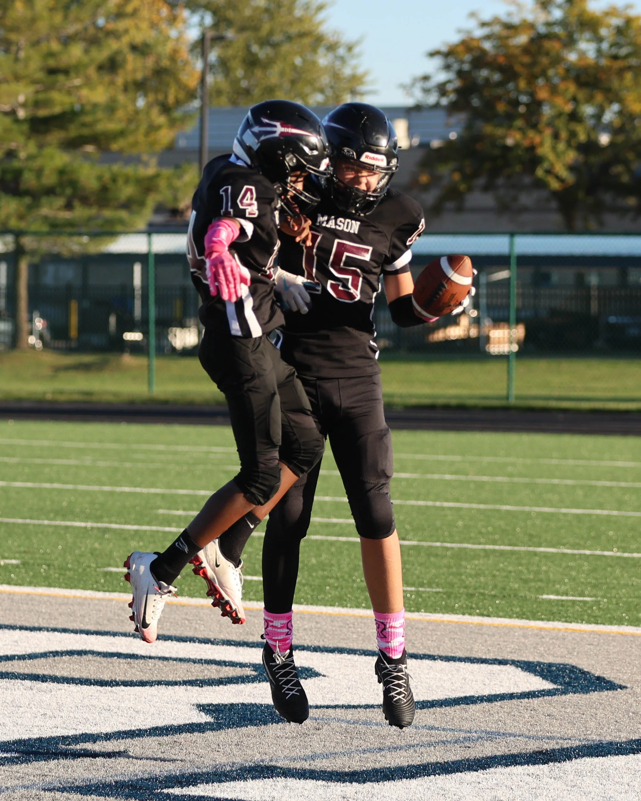 Mason #14 and 15 celebrate the touchdown