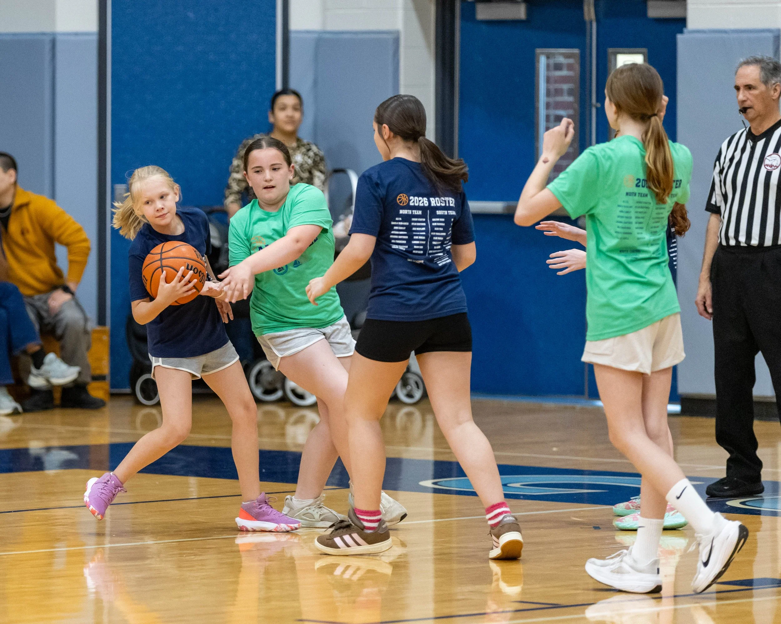 North girl steals the ball from a South girl