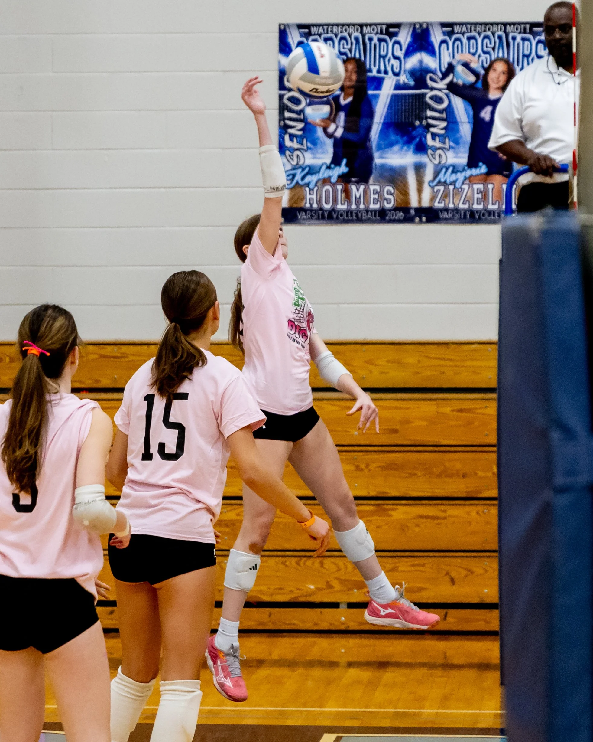 Mason player hits the ball