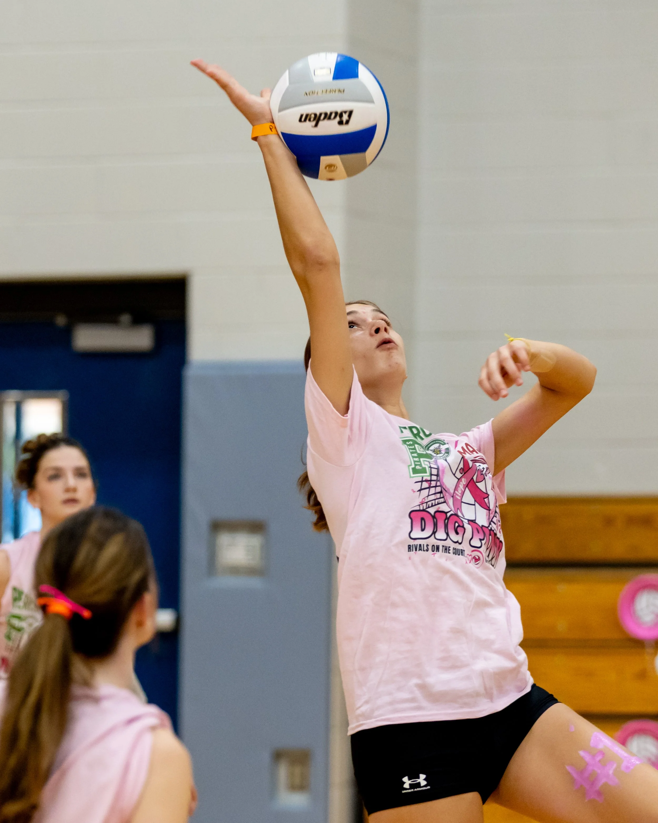 Mason player hits the ball