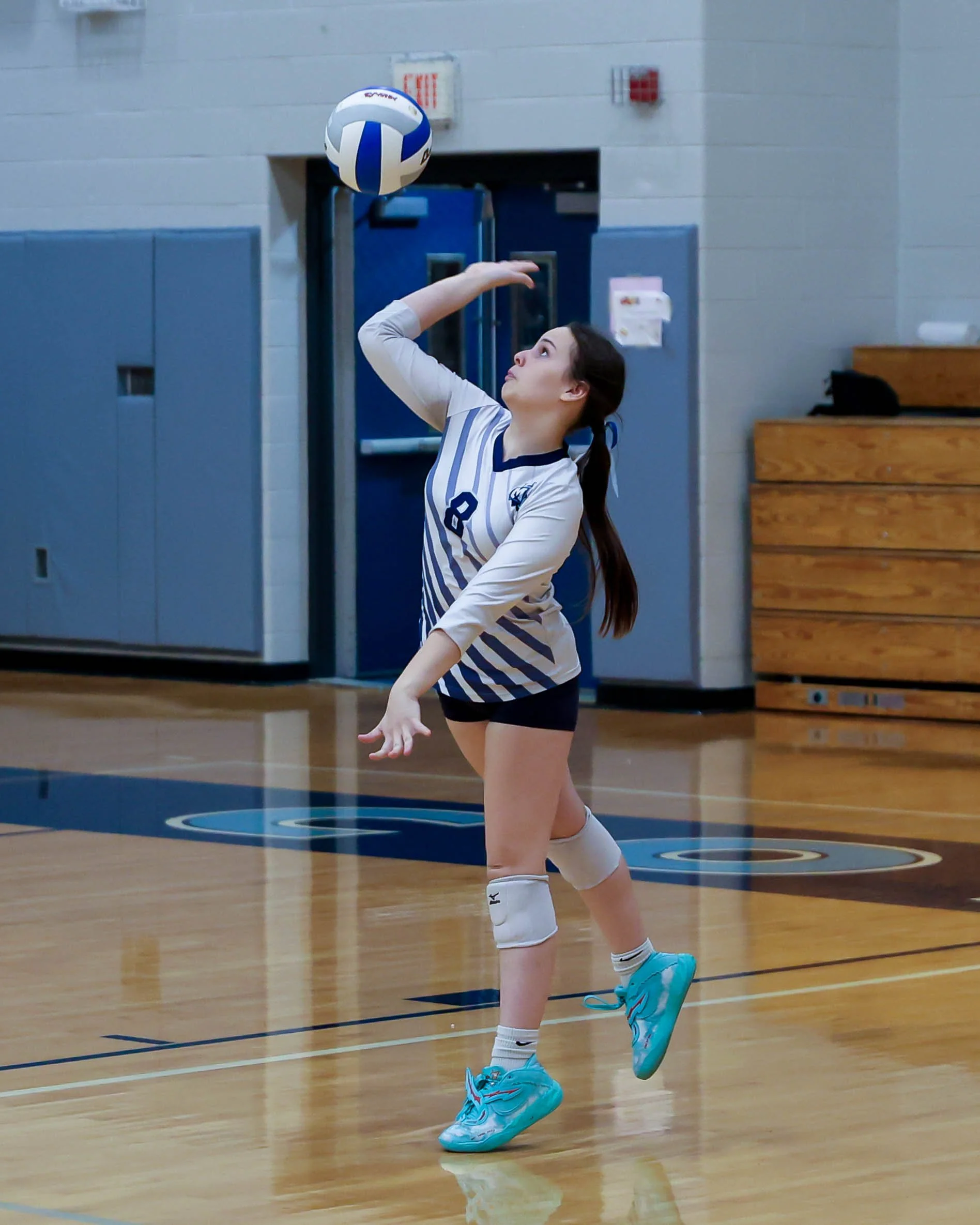 Mott #8 serves the ball