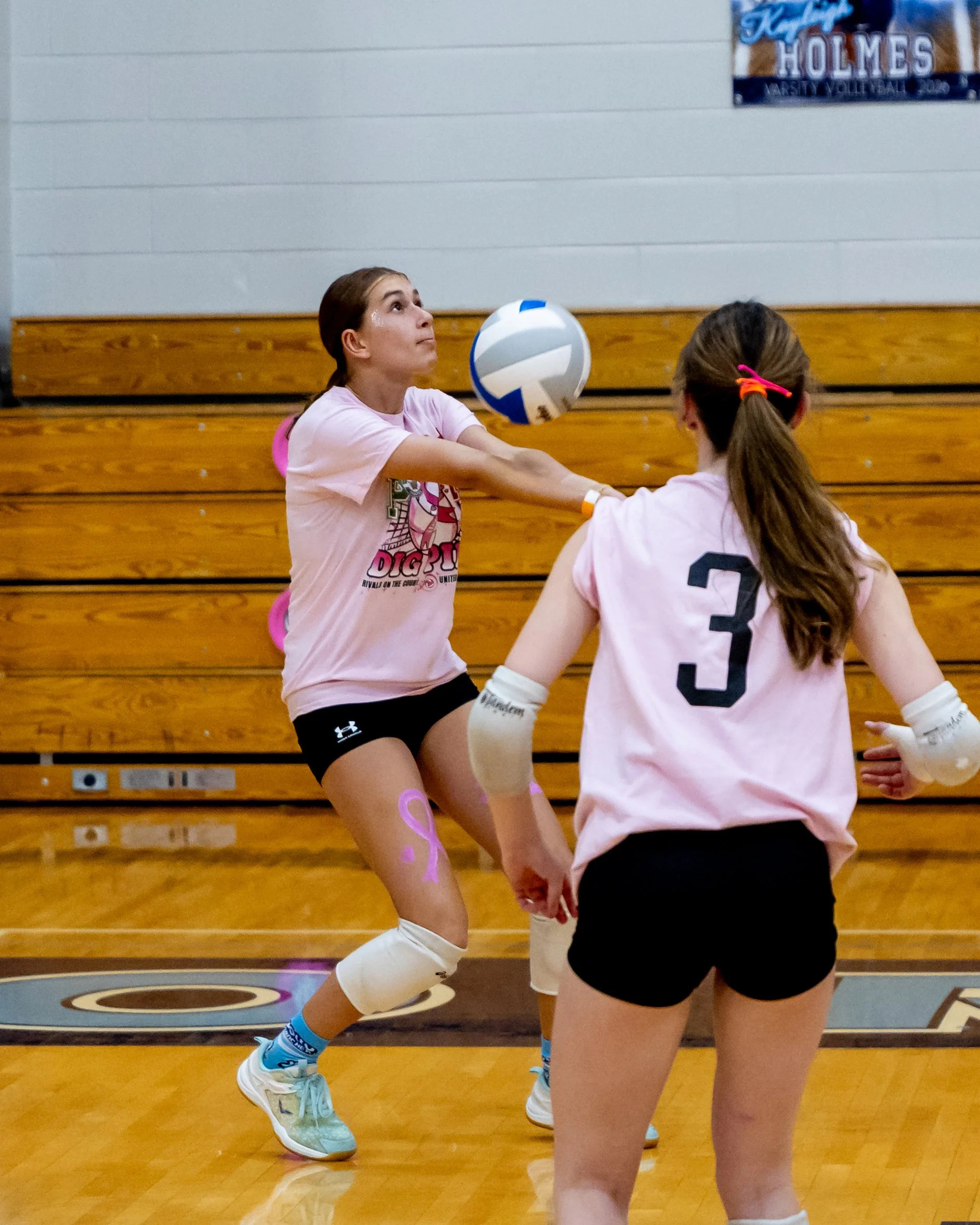 Mason player returns the ball