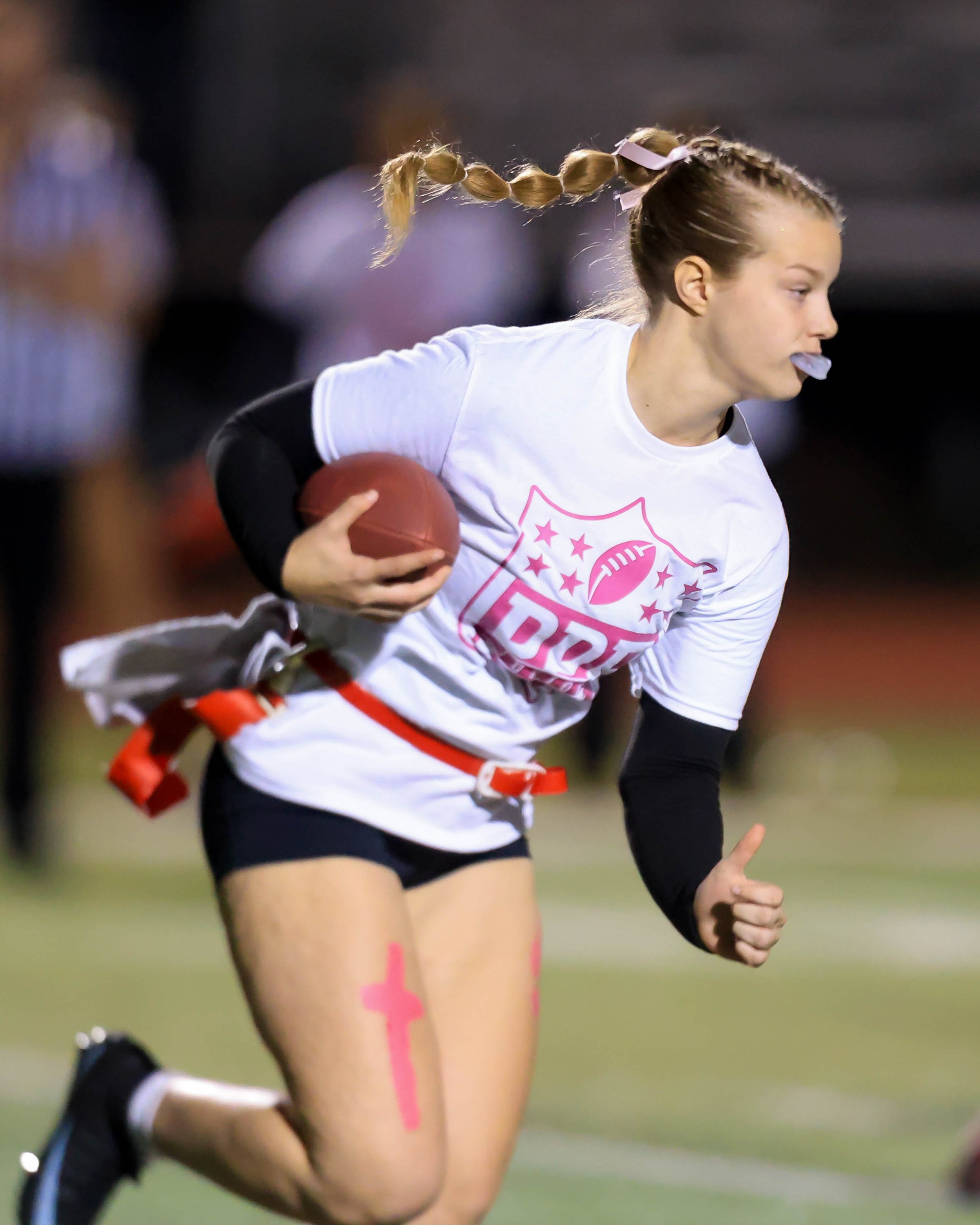 Junior quarterback running with the ball
