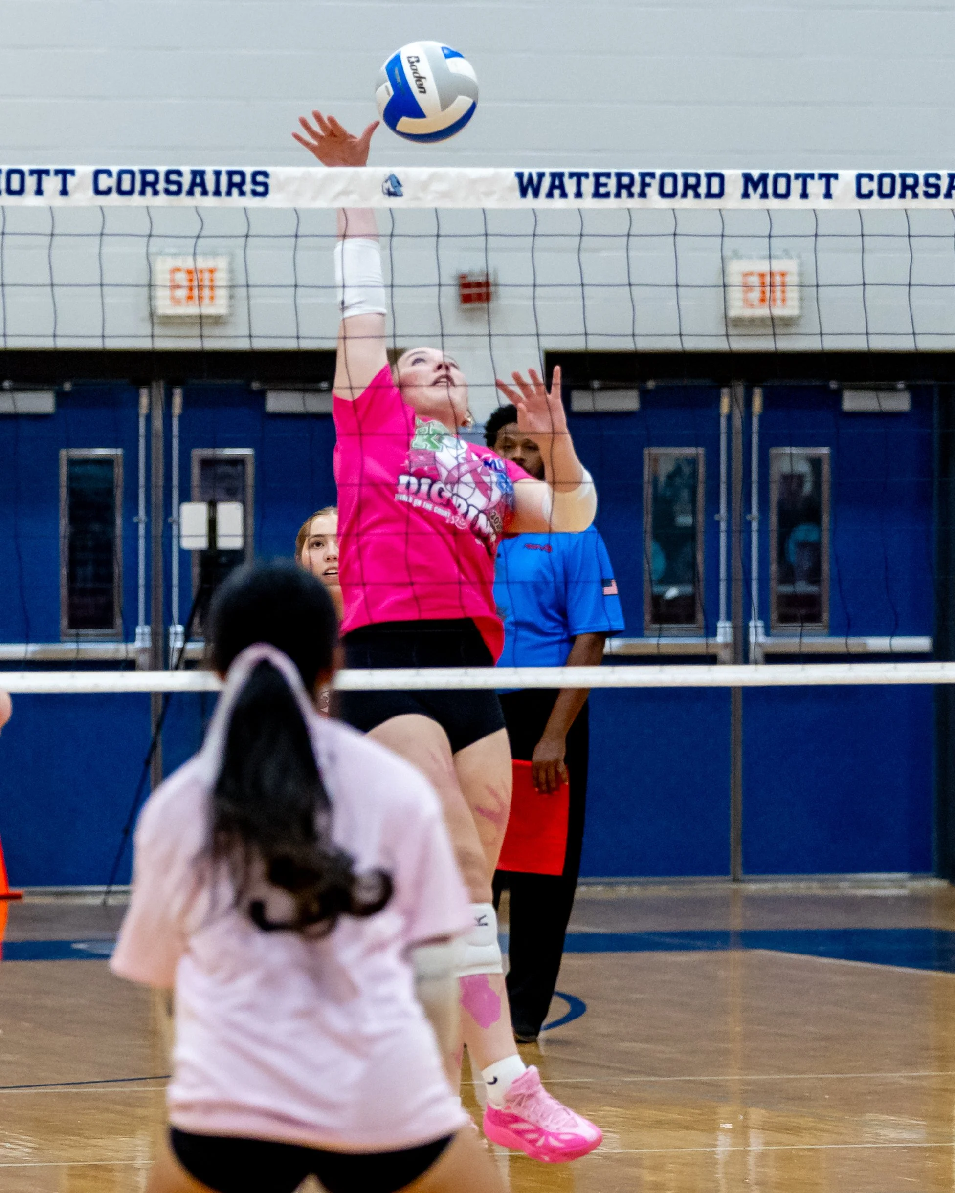 Kettering player hits the ball