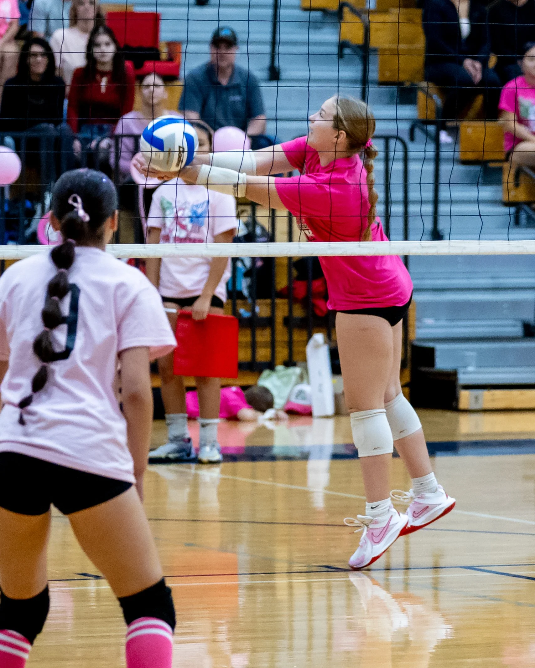 Kettering player hits the ball