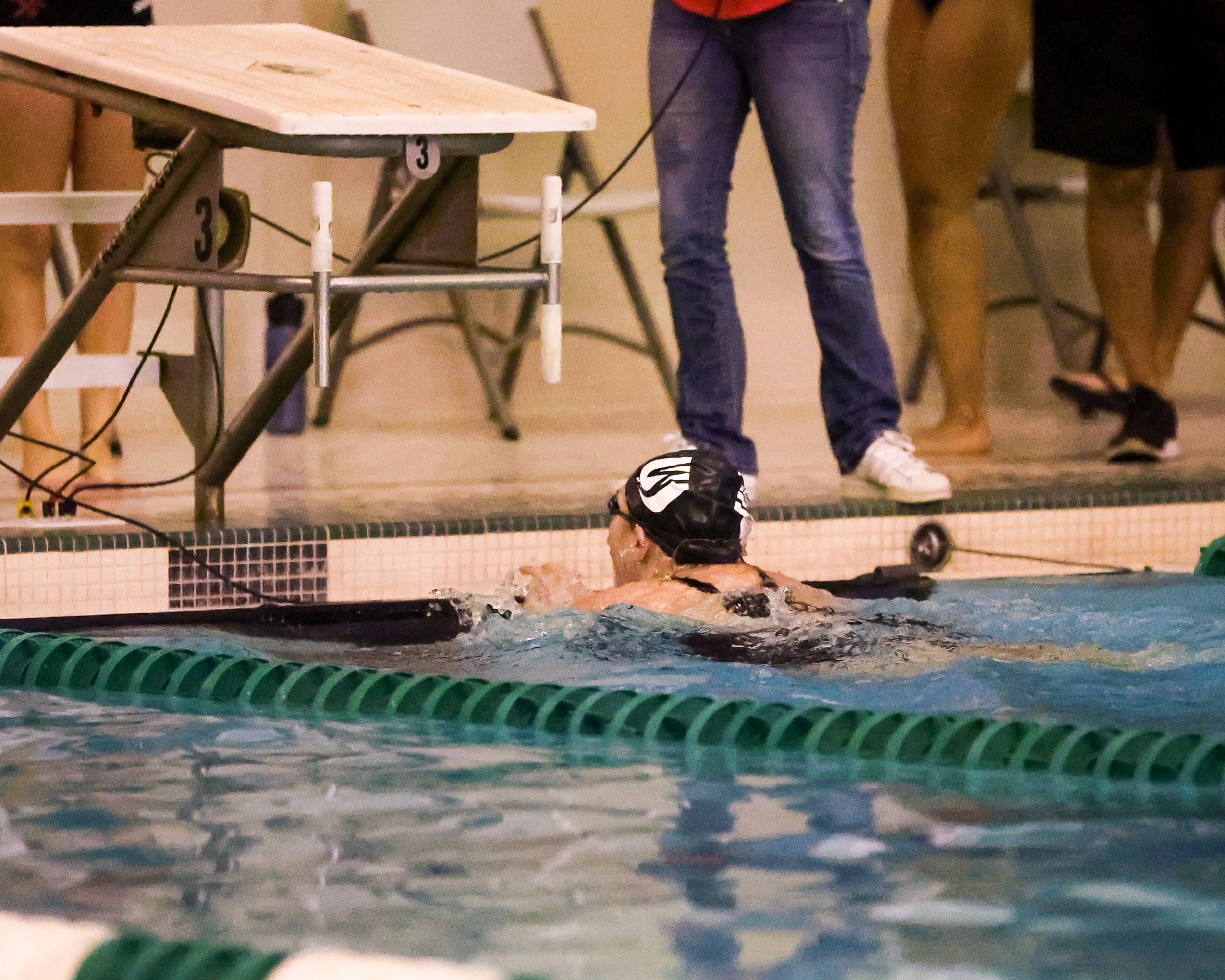 WU swimmer finishes the 100 Yard Breaststroke