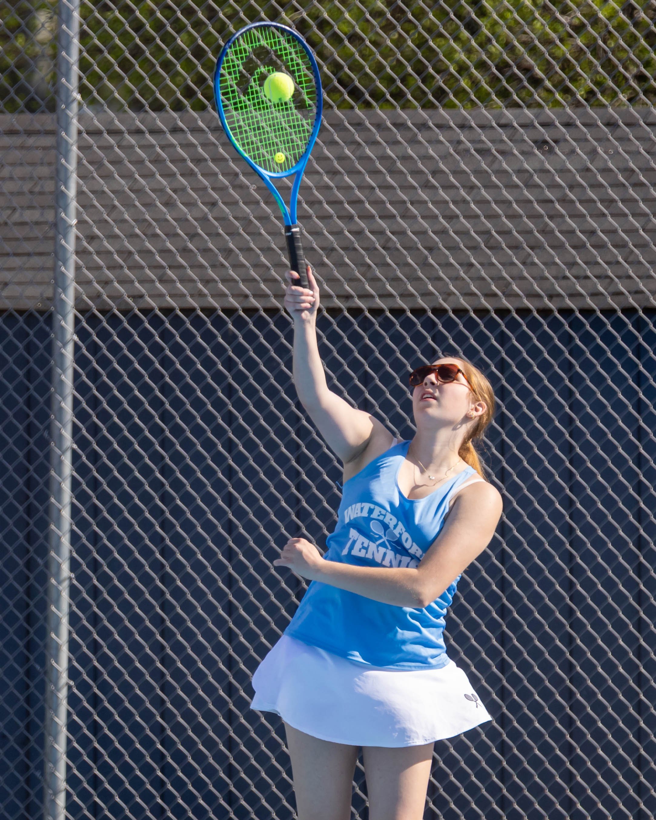 Waterford United player serves the ball