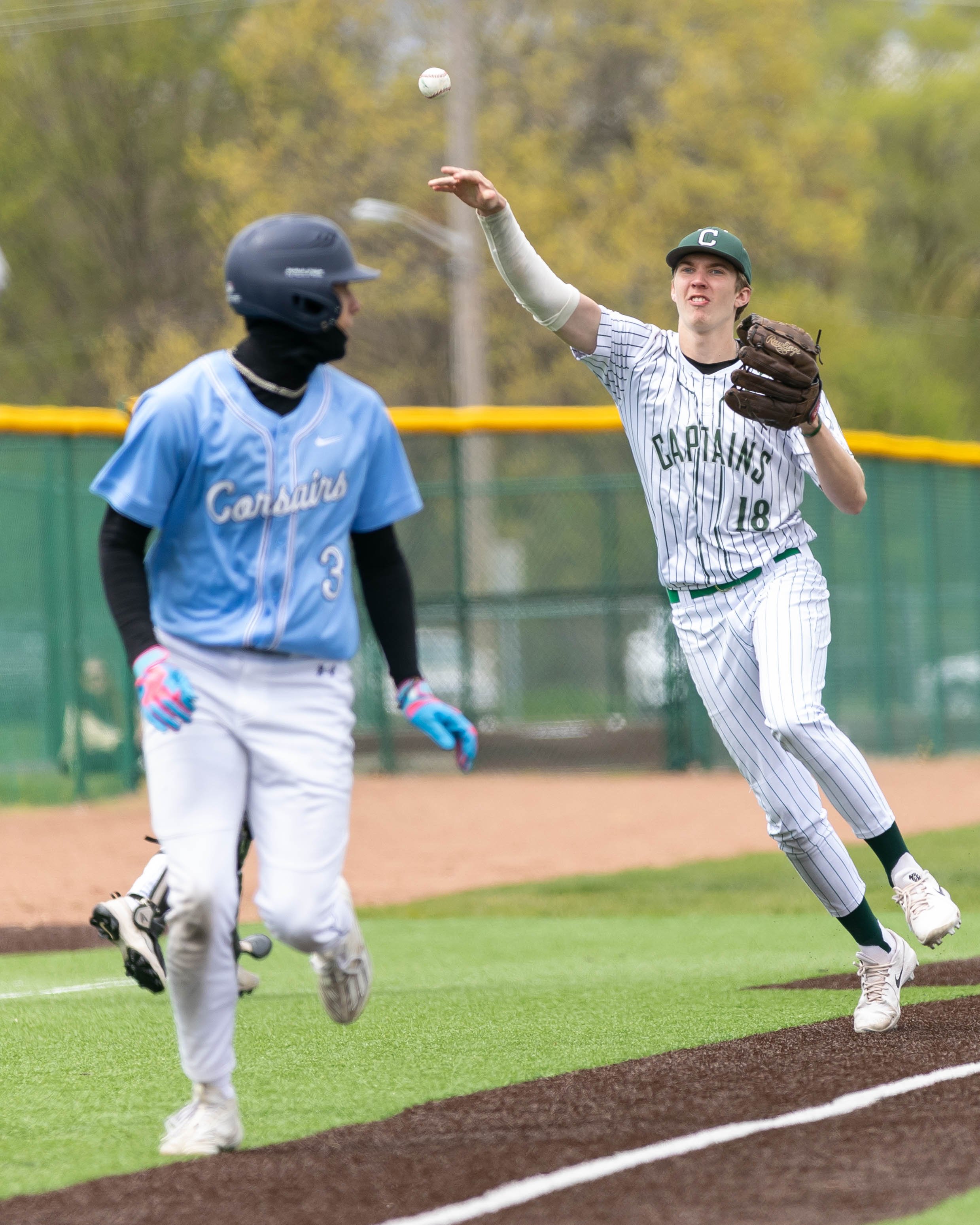 Kettering #18 throws the ball to home plate 