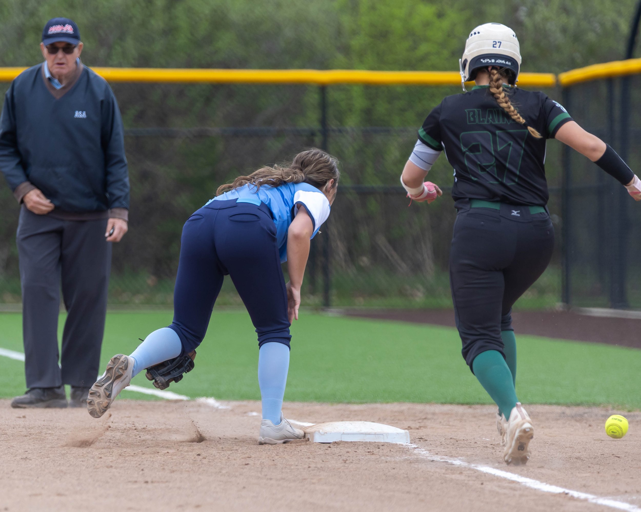 Kettering #27 safe at first on pass ball