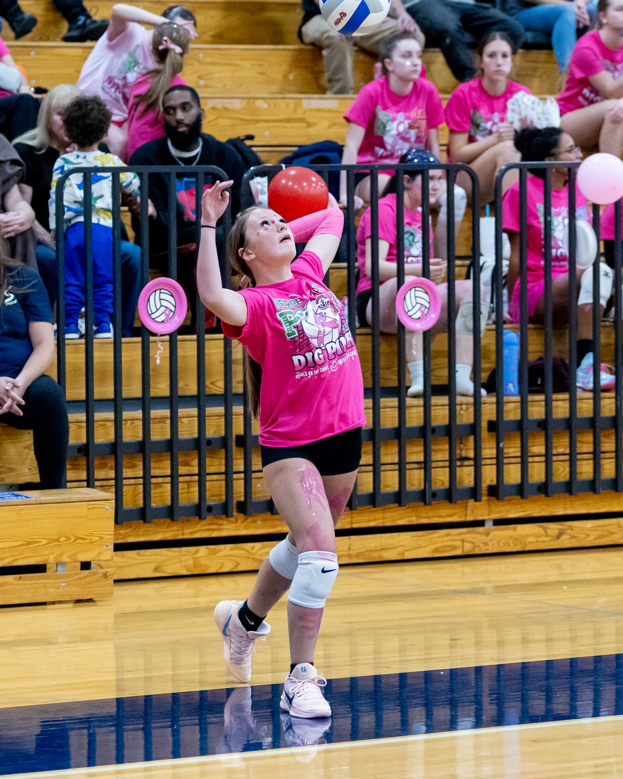 Pierce player serves the ball