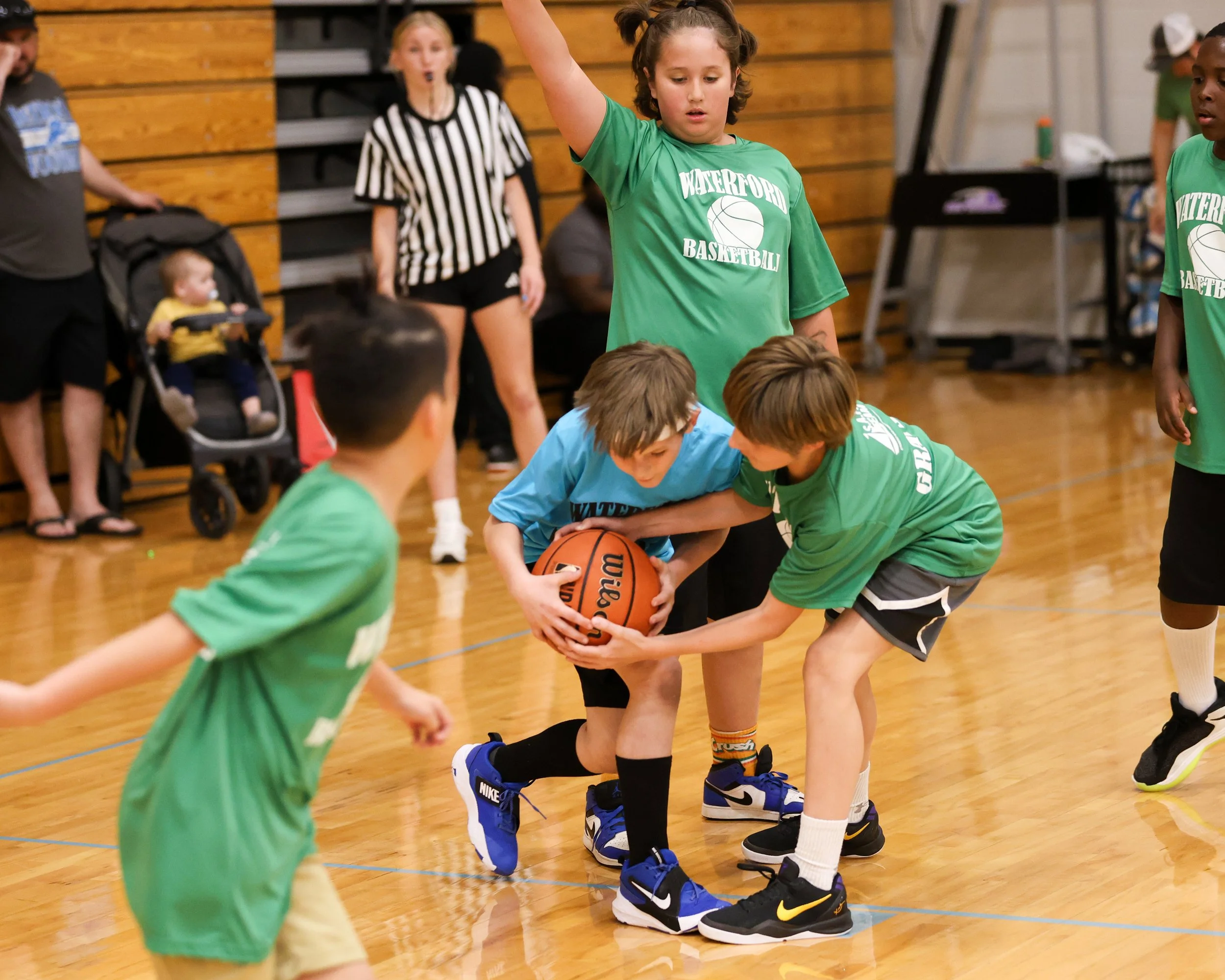 Cooley boy and Grayson boy battle for ball