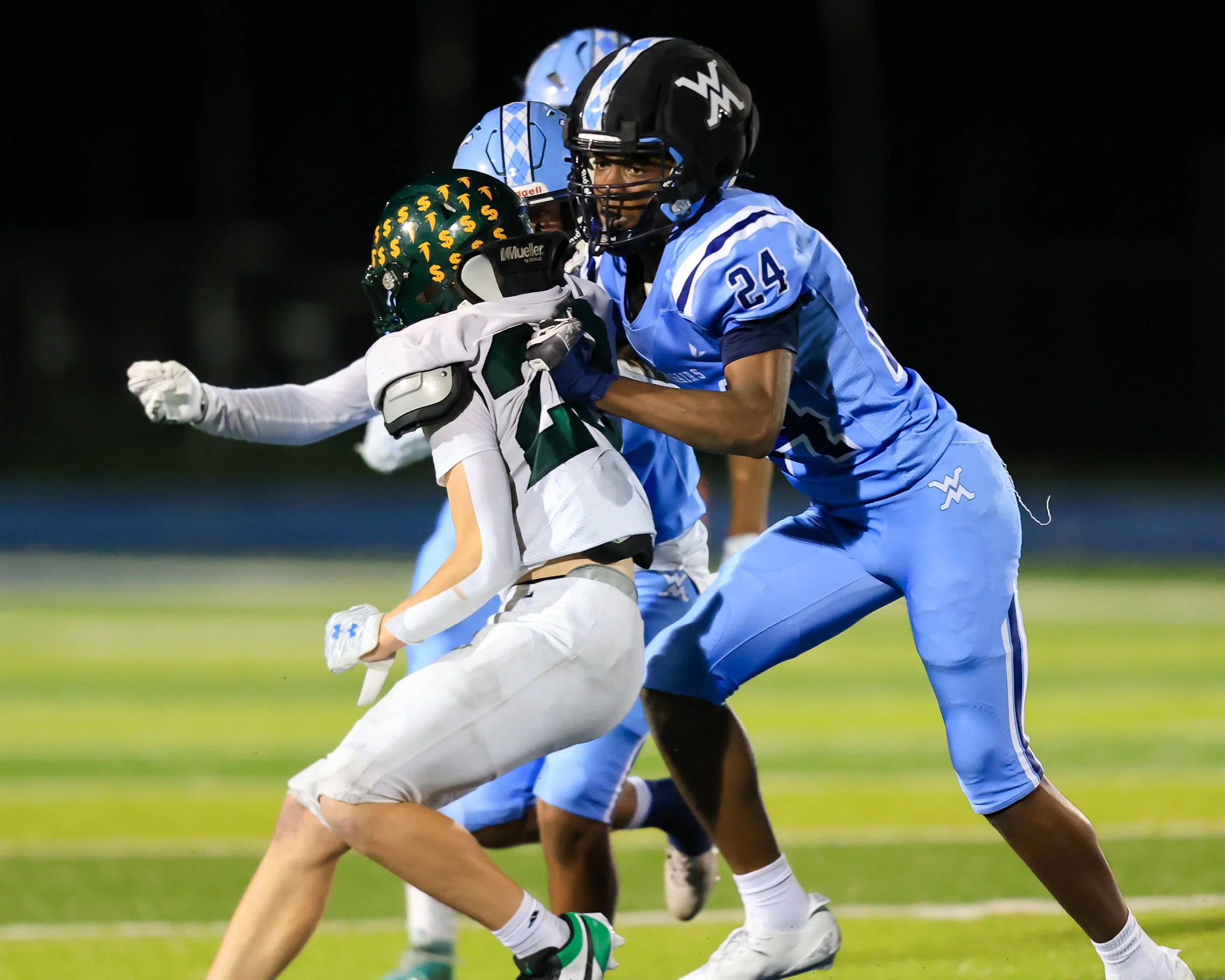 Mott #24 blocks for the ball carrier