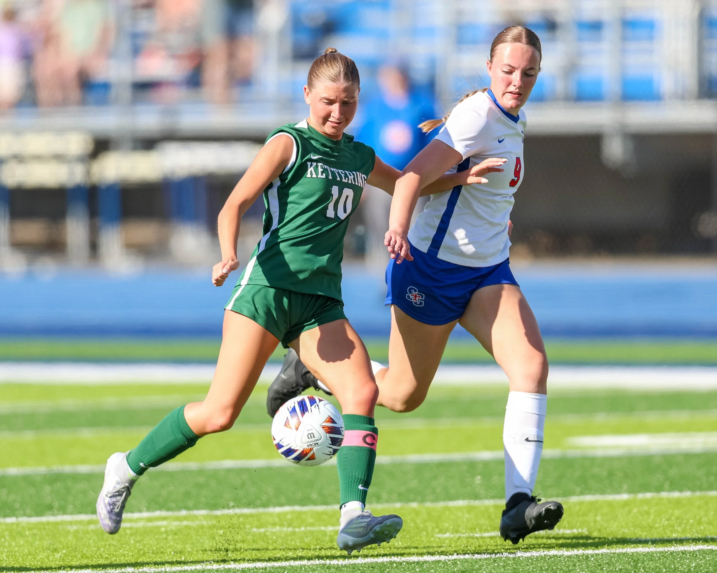 #10 with the ball between her feet