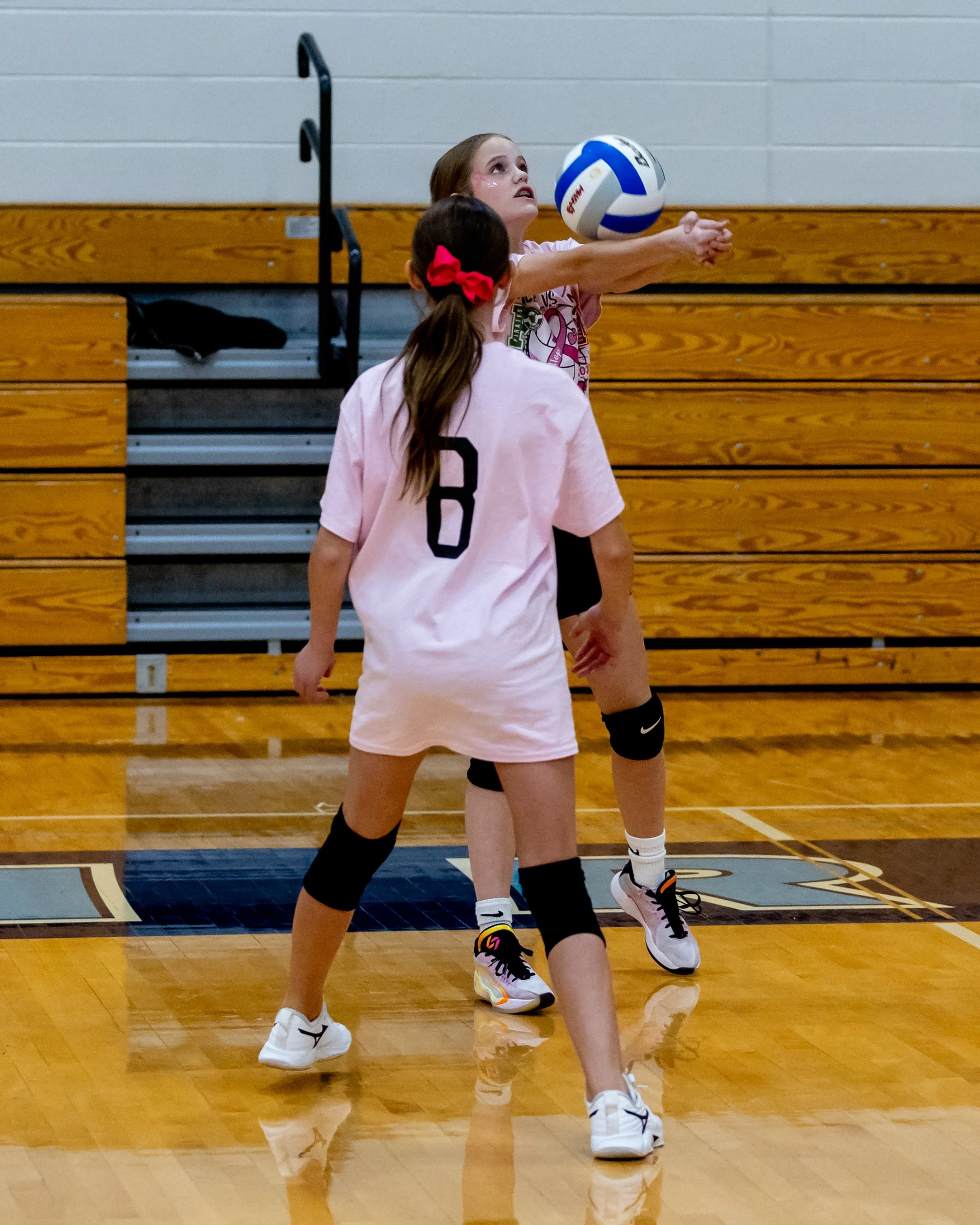 Mason player hits the ball