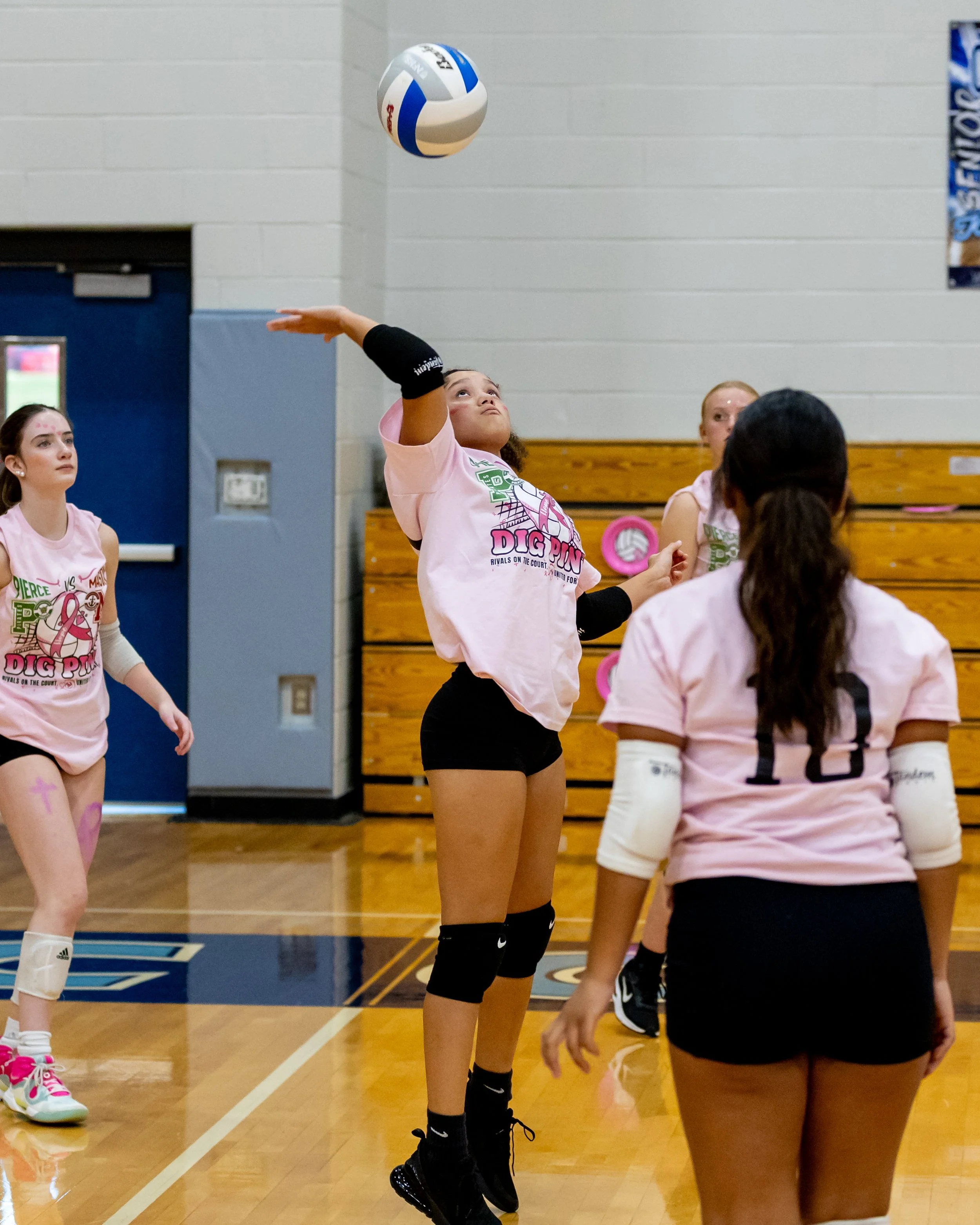 Mason player hits the ball
