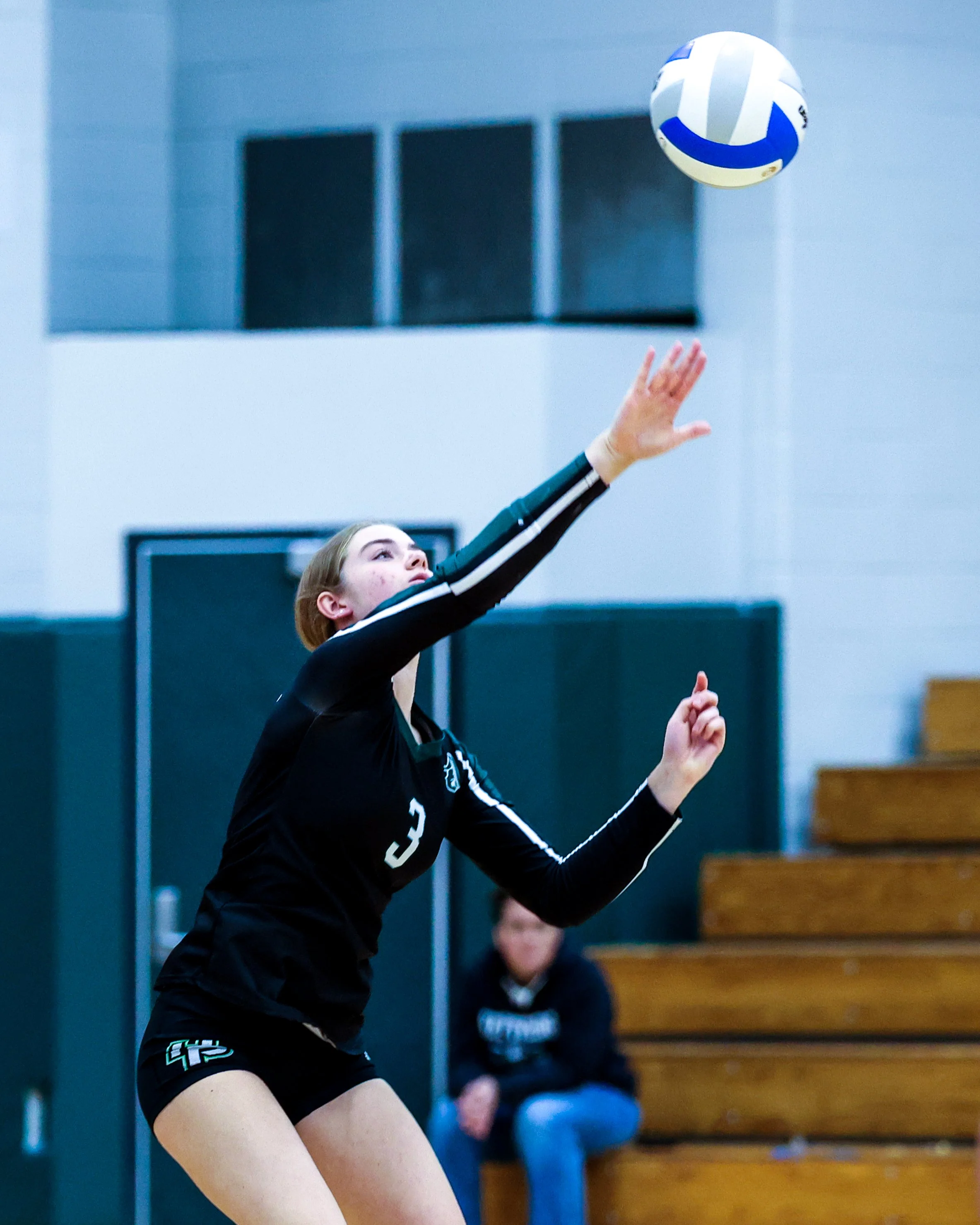 WK #3 serves the ball