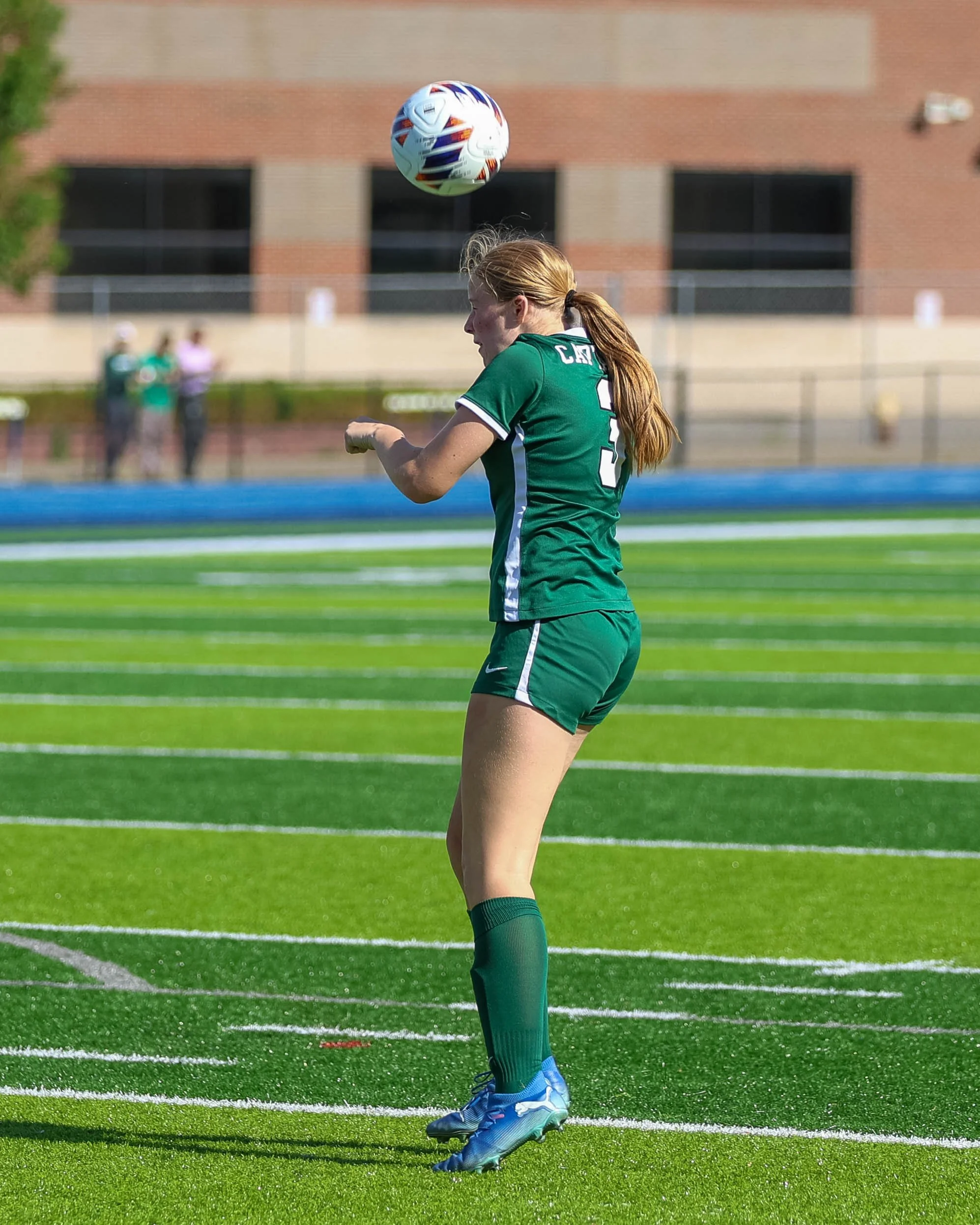 #3 heads the ball