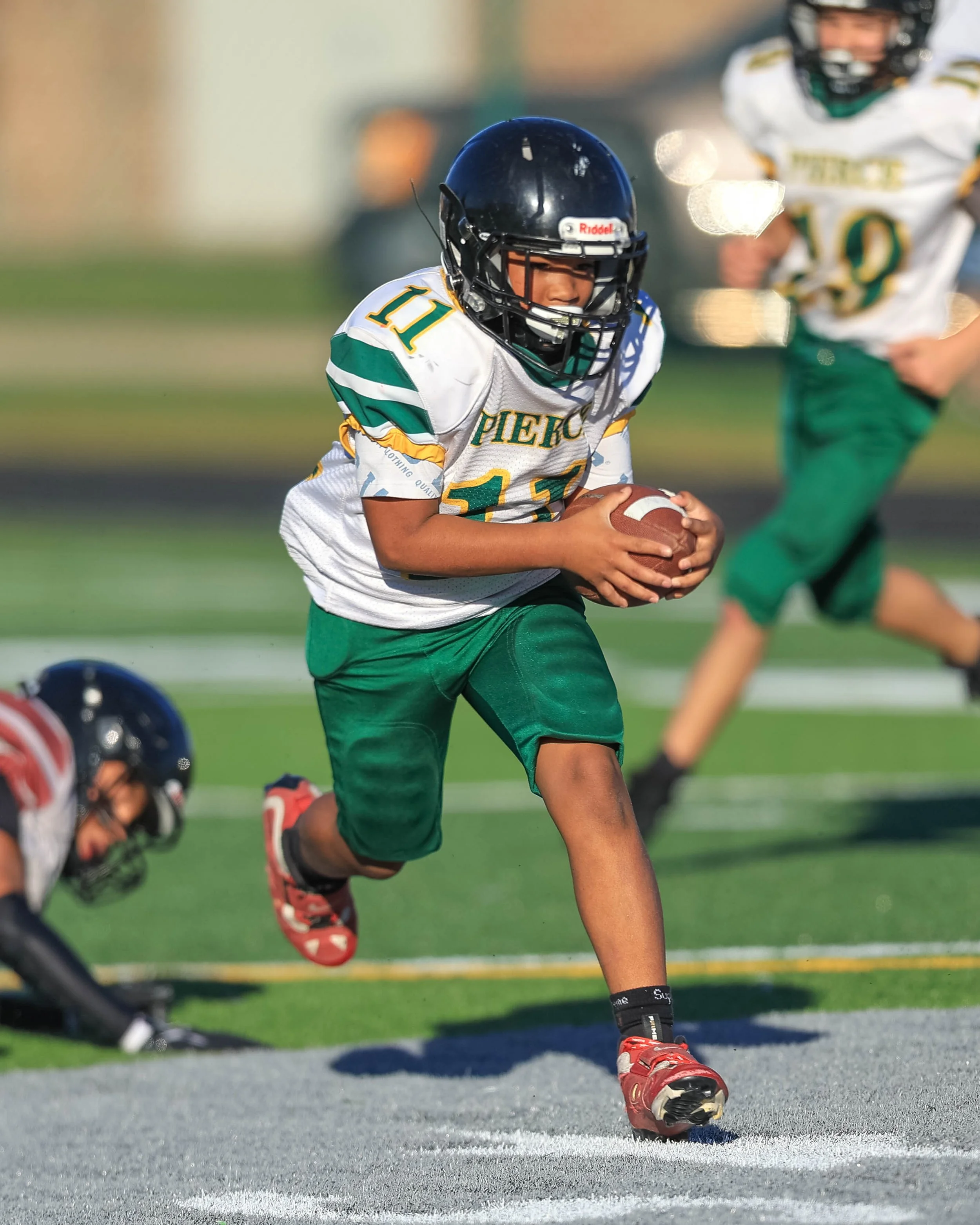 Pierce #11 carries the ball