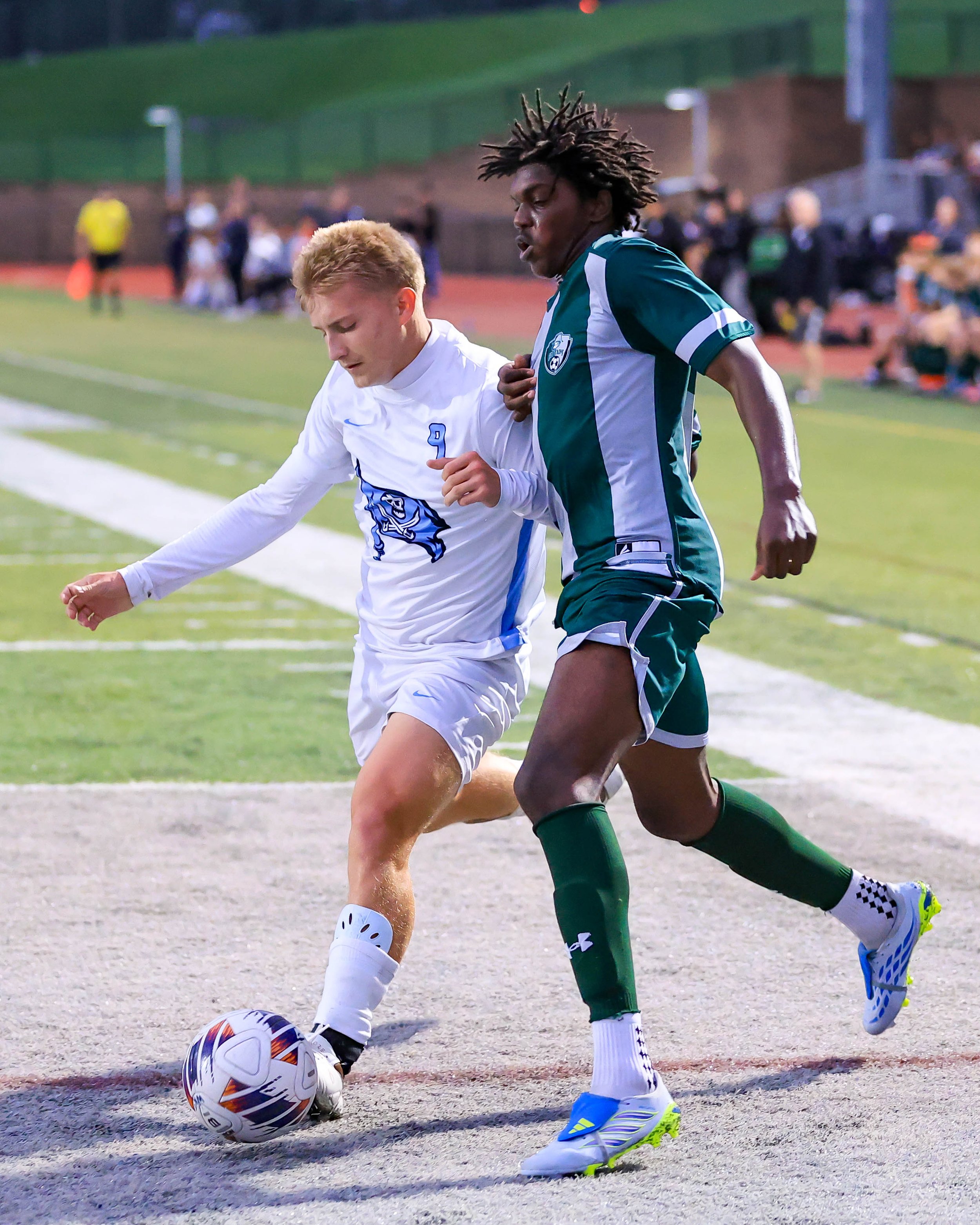 WK # 9 and WM #9 fight for the ball