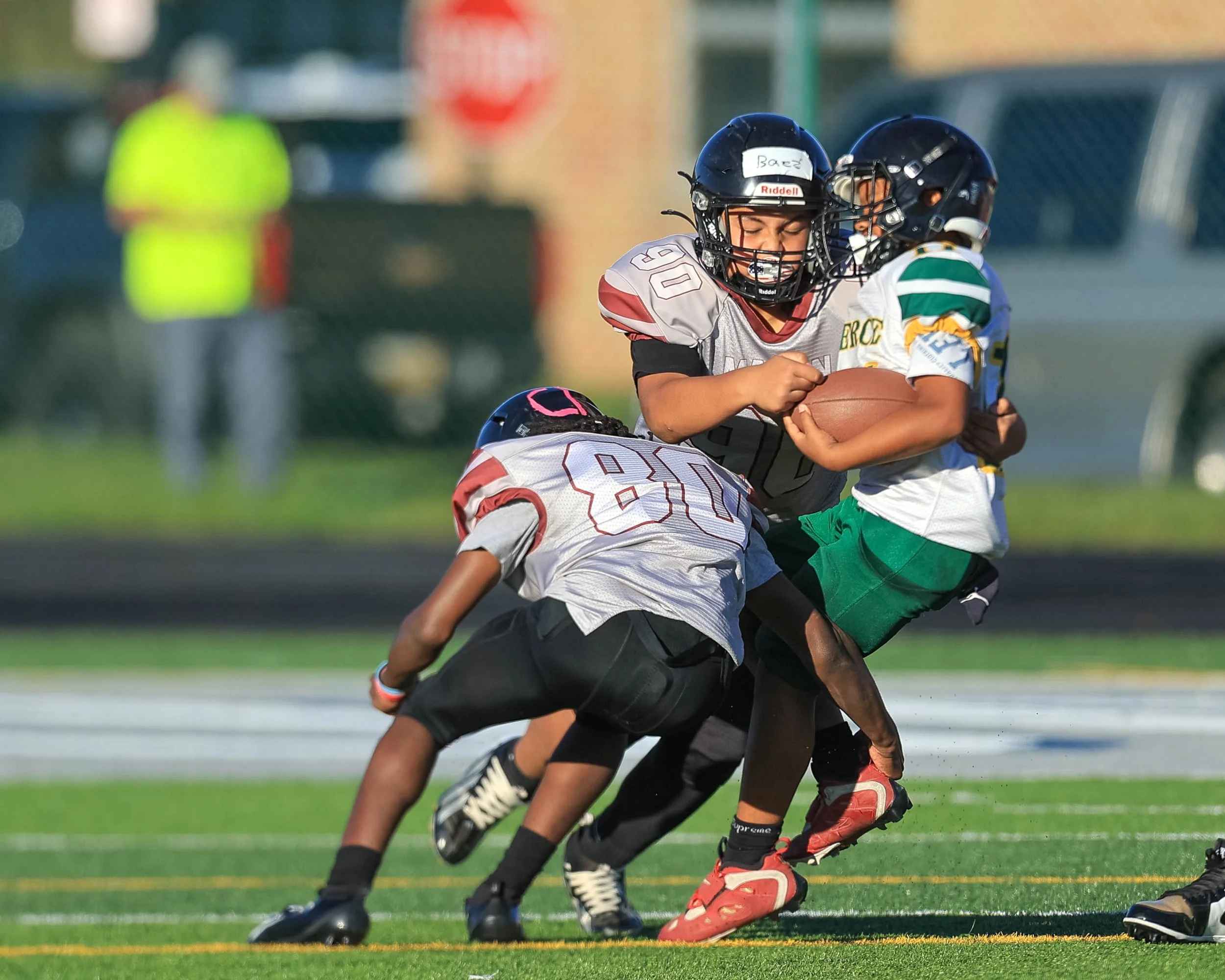 Mason #80 and #90 tackle Pierce #11