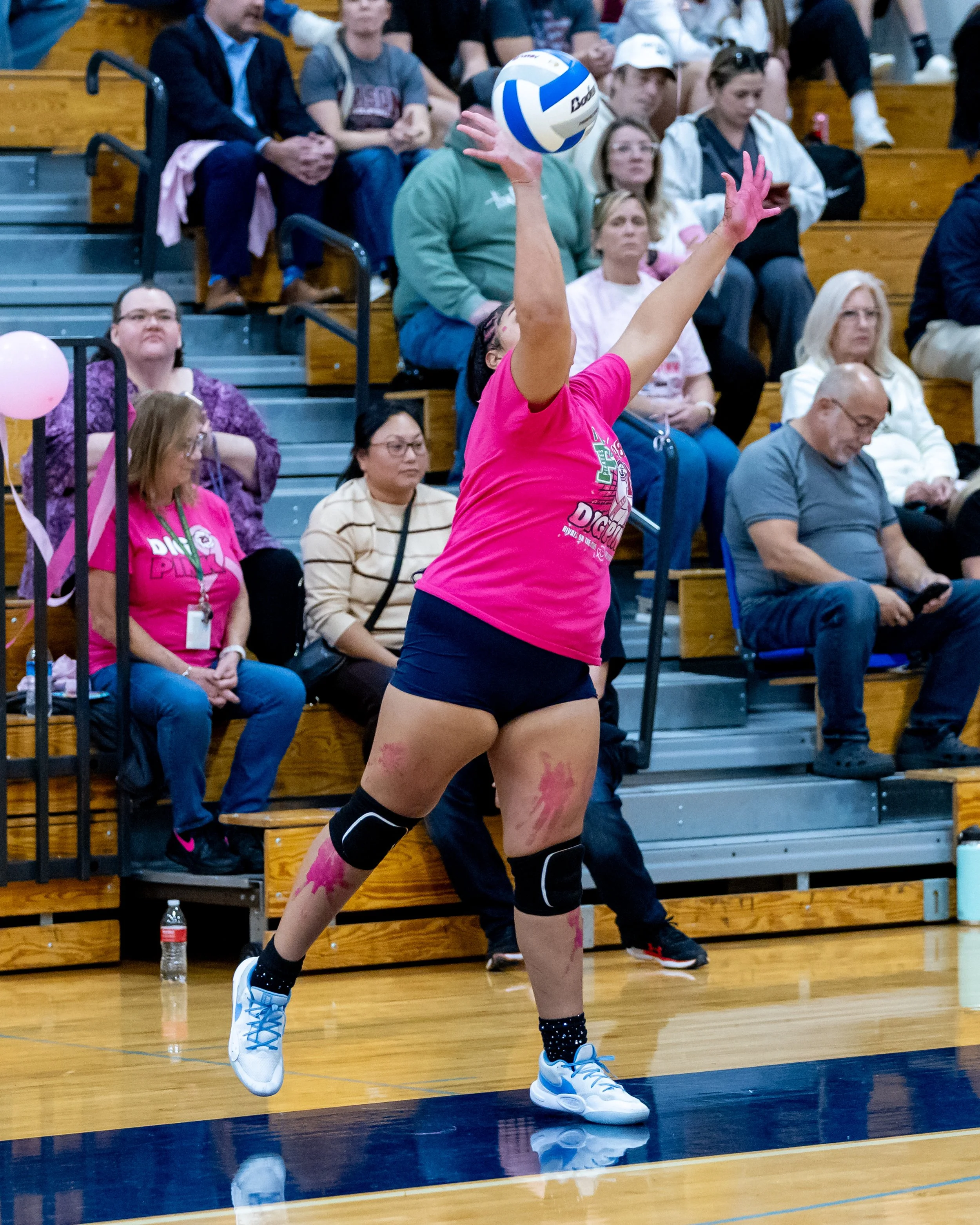 Pierce player serves the ball