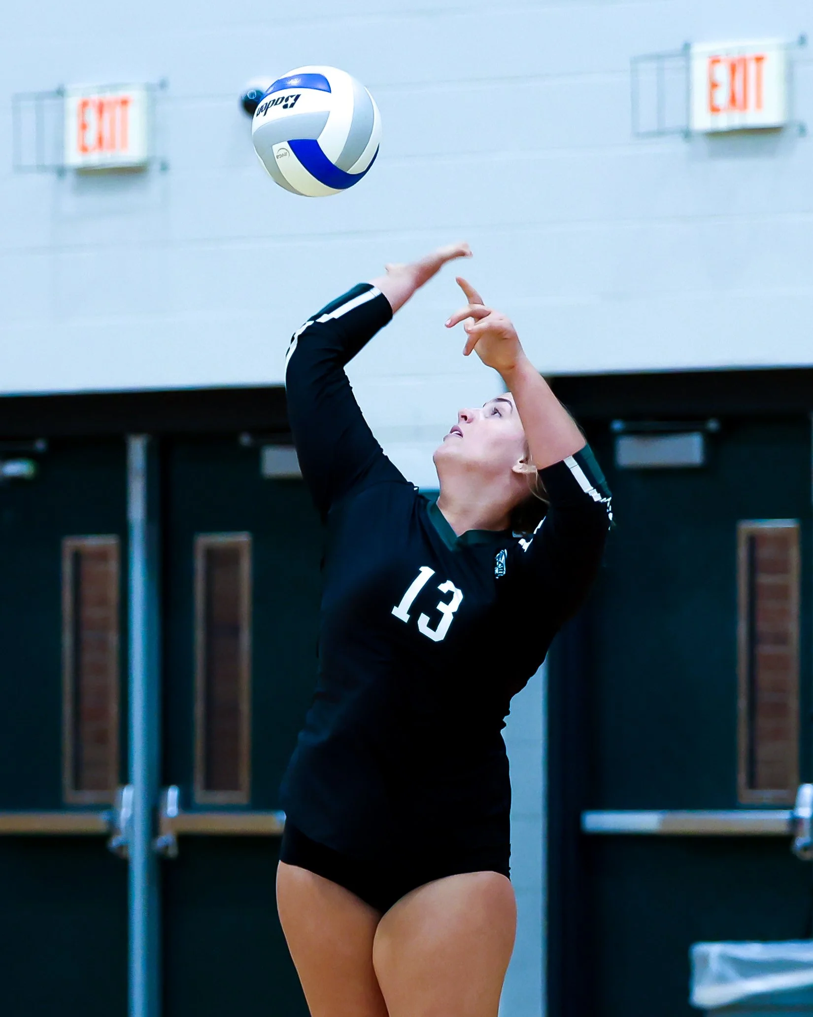 WK #13 serves the ball